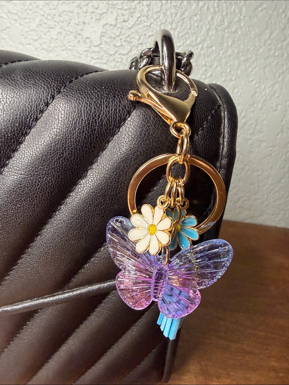 Gold Charm Keychain with Purple Butterfly and Daisy Accents